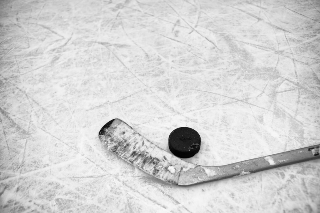 Close up of Ice Hockey Stick on Rink